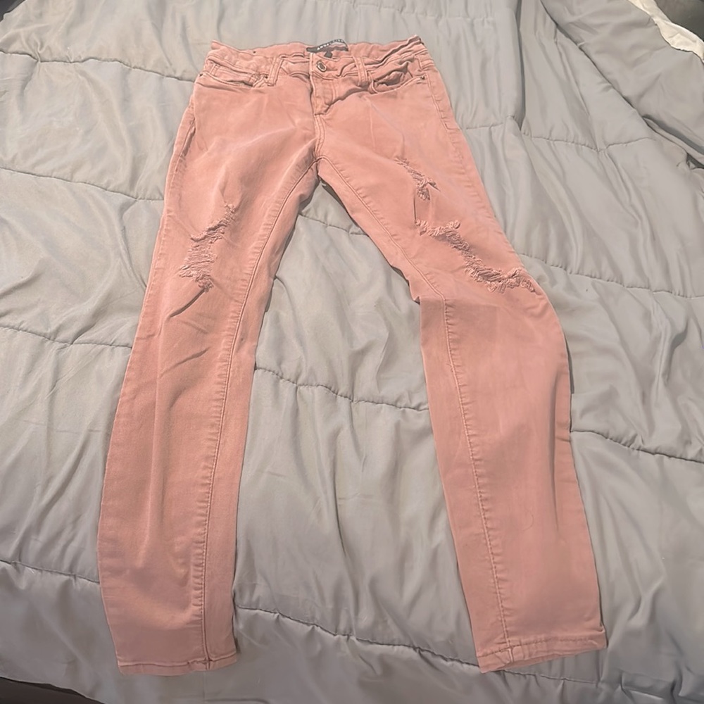 Rustic pink ripped jeans, worn once, size 5.